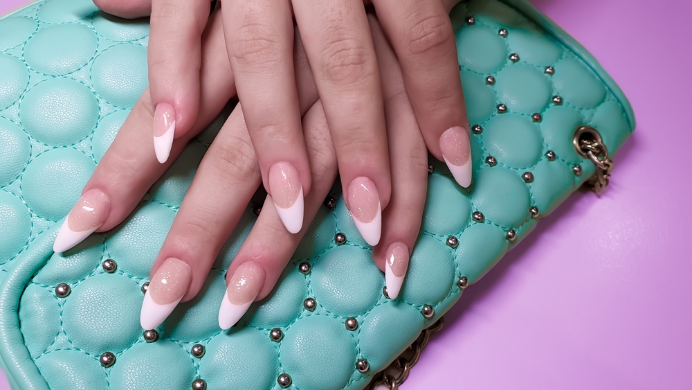 acrylic,nail,extension,,manicure,,nail,correction,,hands,in,the,foreground.